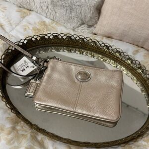 NWT Coach Metallic Beige Wristlet